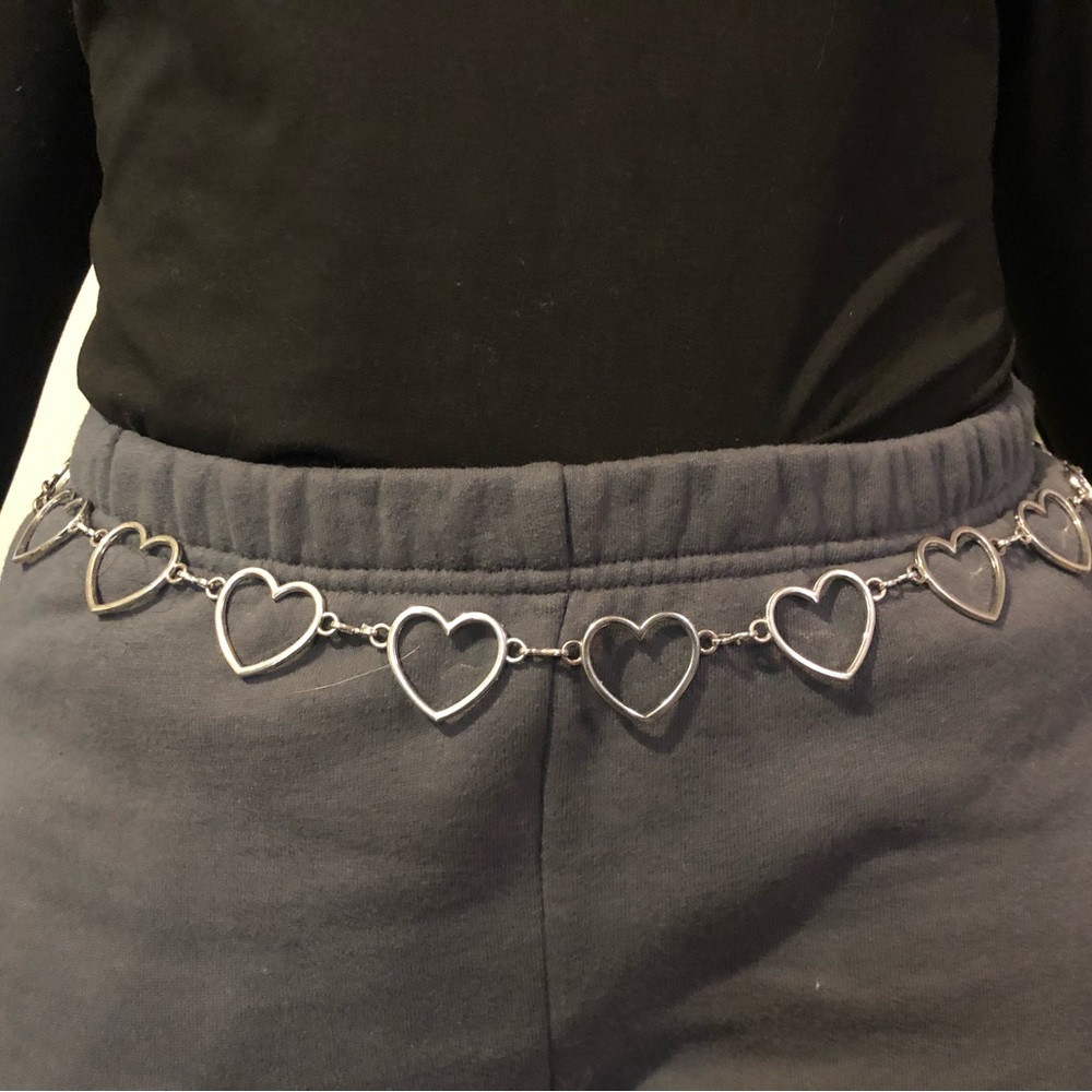 Silver heart shaped belt with clasp, fits up to a size XL.